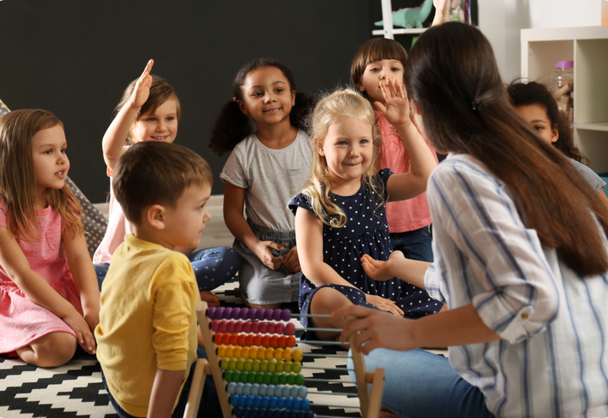 cute-little-children-with-nursery-teacher-in-kinde-2026-03-27-17-08-16-utc 1